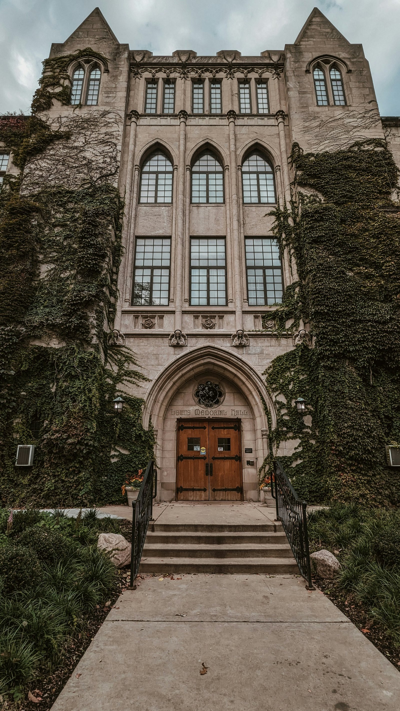 An ivy-covered gothic building facade