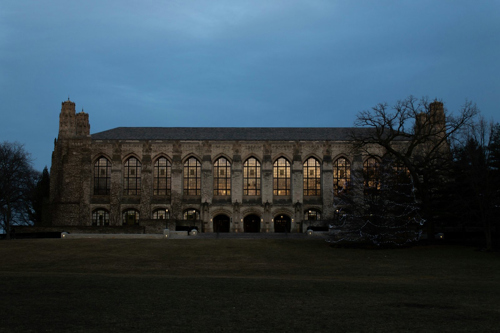 A university library lit at dusk