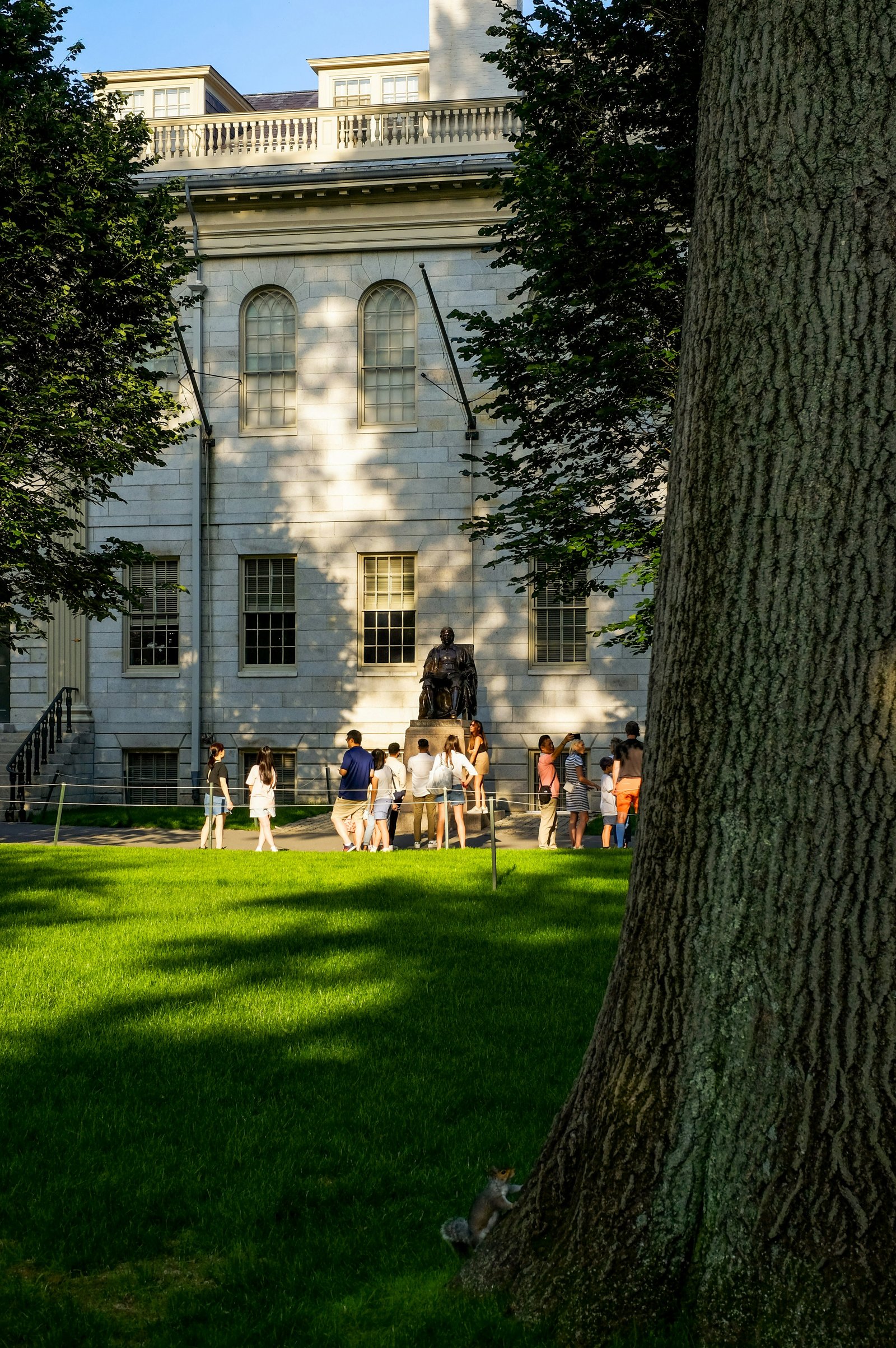 Visitors on a campus lawn